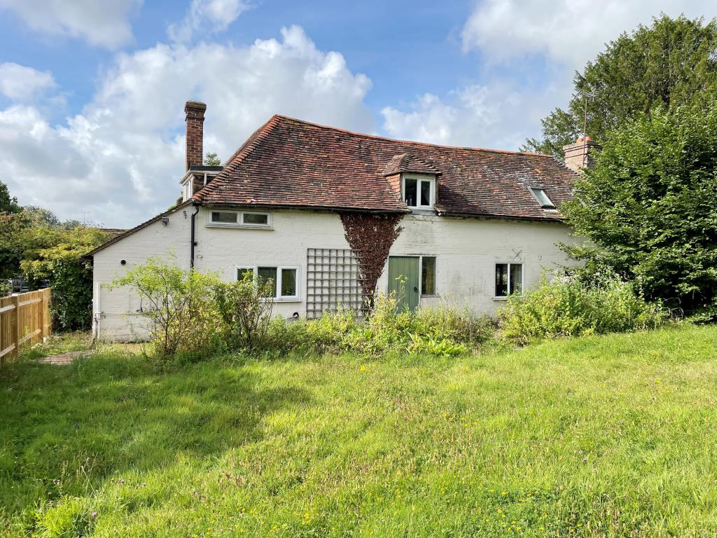 Lot: 69 - CHARACTER COTTAGE IN NEED OF UPDATING AND REPAIR - Front elevation with lawned garden and fence